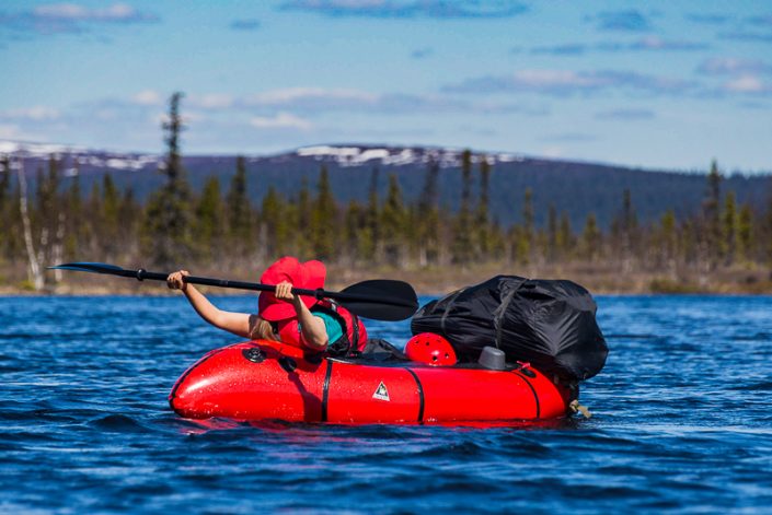 A relaxed paddler in the Sjaunja wilderness