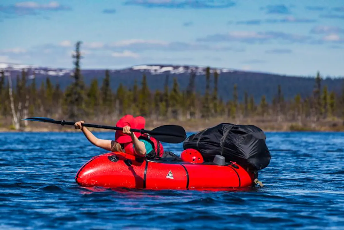 A relaxed paddler in the Sjaunja wilderness